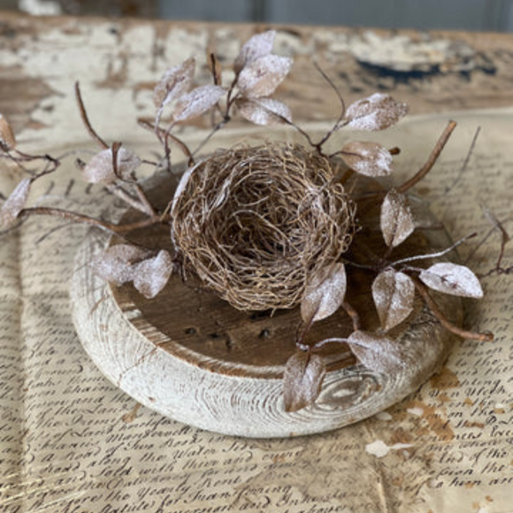 neutral colored nest with glittered leaves