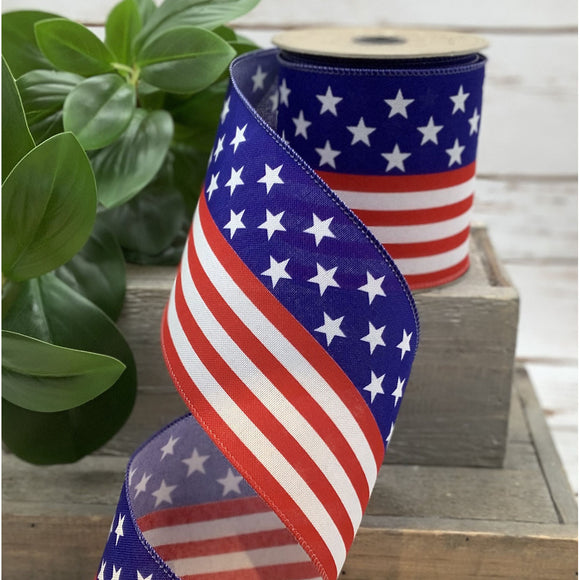 Roll of American flag ribbon with green leaves