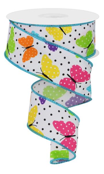 Multi color butterflies on white background with black polka dots and aqua colored edging