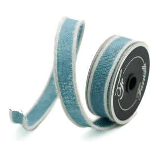 Roll of burlap ribbon in light blue with white edges