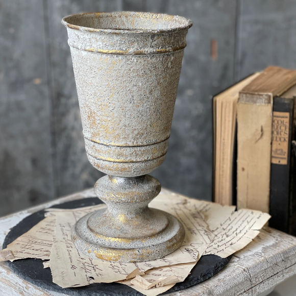 gold and white urn